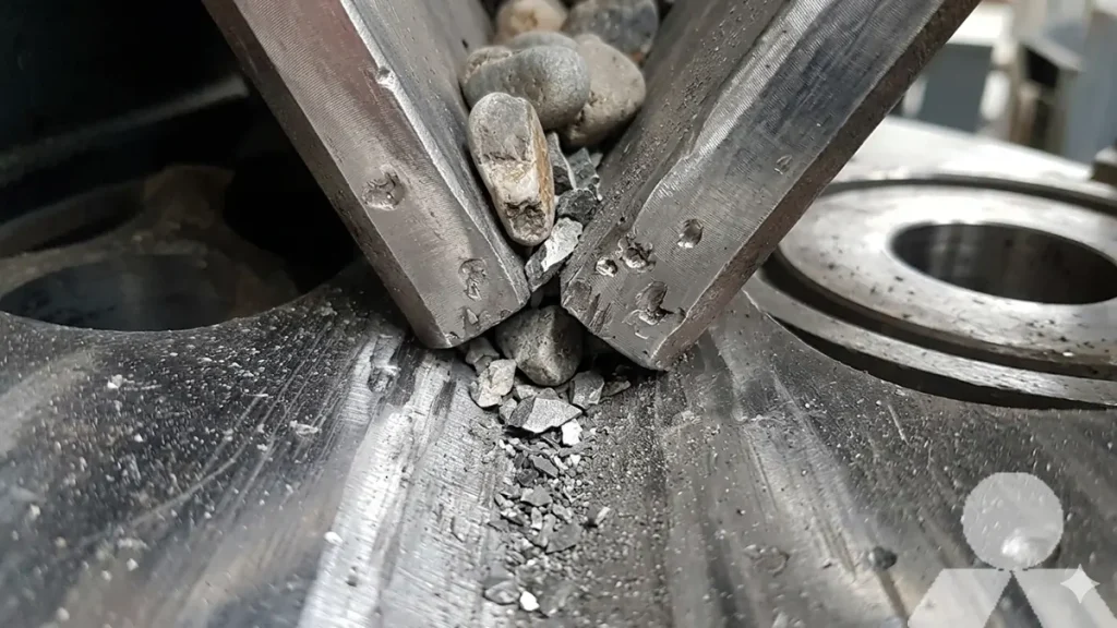 A sharp, close-up shot of an HPT hydraulic cone crusher's mantle and concave interface, displaying minor wear patterns after processing 150 MPa river pebbles.