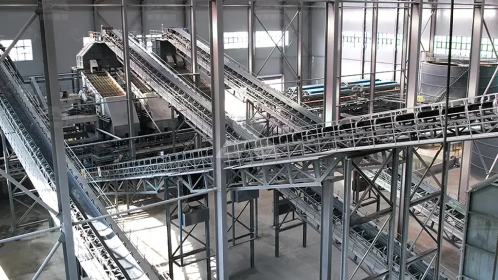 A close-up shot of the core equipment, demonstrating the efficient joint operation of the HST single-cylinder hydraulic cone crusher and the VSI5X vertical shaft impact crusher